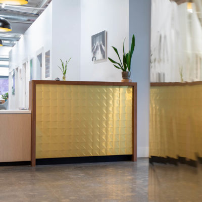 Chemetal 903 T Polished Brass Triangles - reception desk